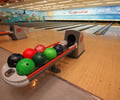 Image: A bowling ball sitting on the rack
